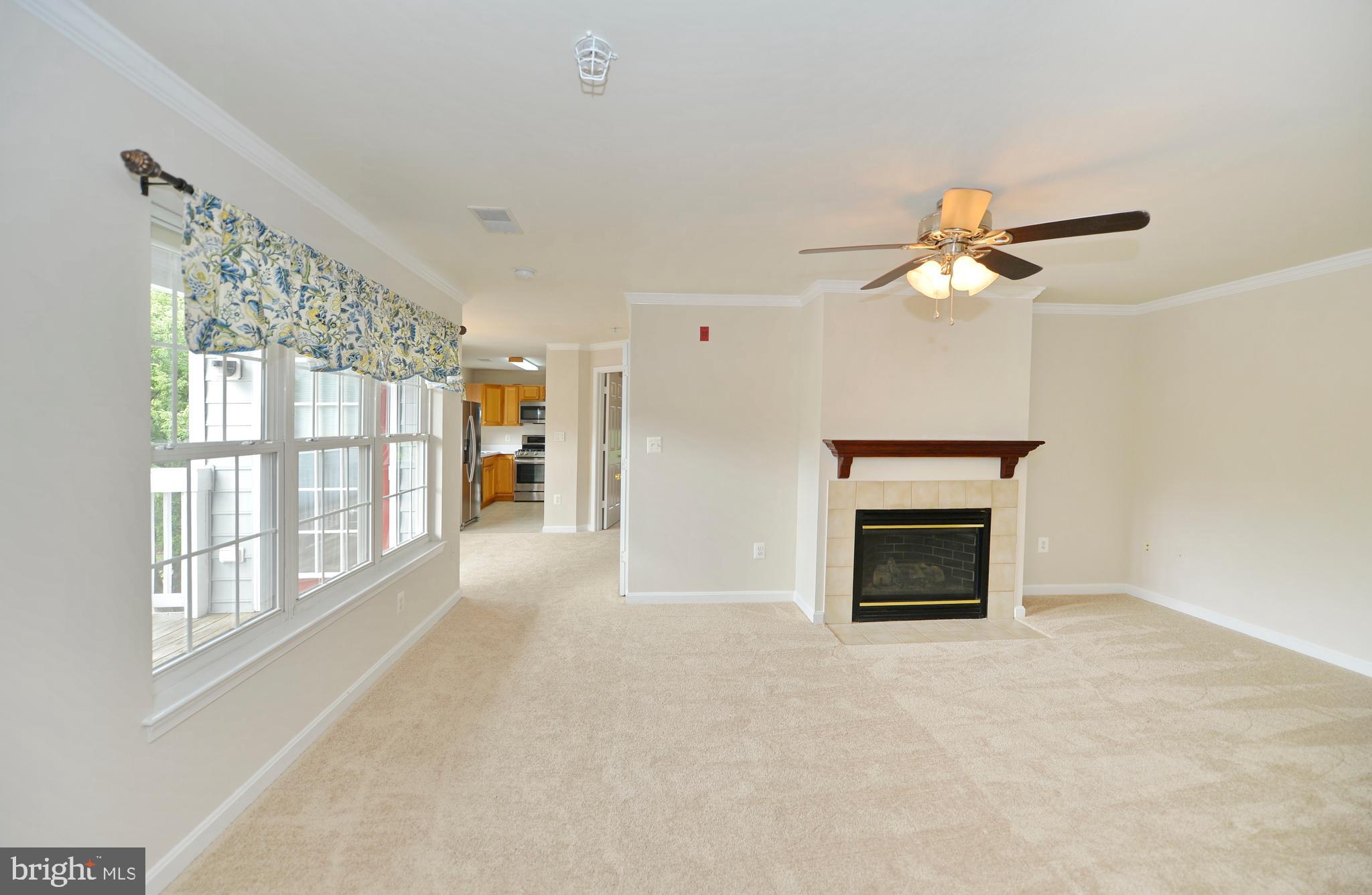 511 Constellation Square Southeast, Unit E Leesburg, VA 20175 - Photo 8 of 34 Living Room to Kitchen