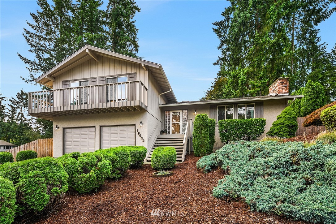 16433 Southeast 149th Street Renton, WA 98059 - Photo 1 of 22 a view of a house with large windows and a small yard