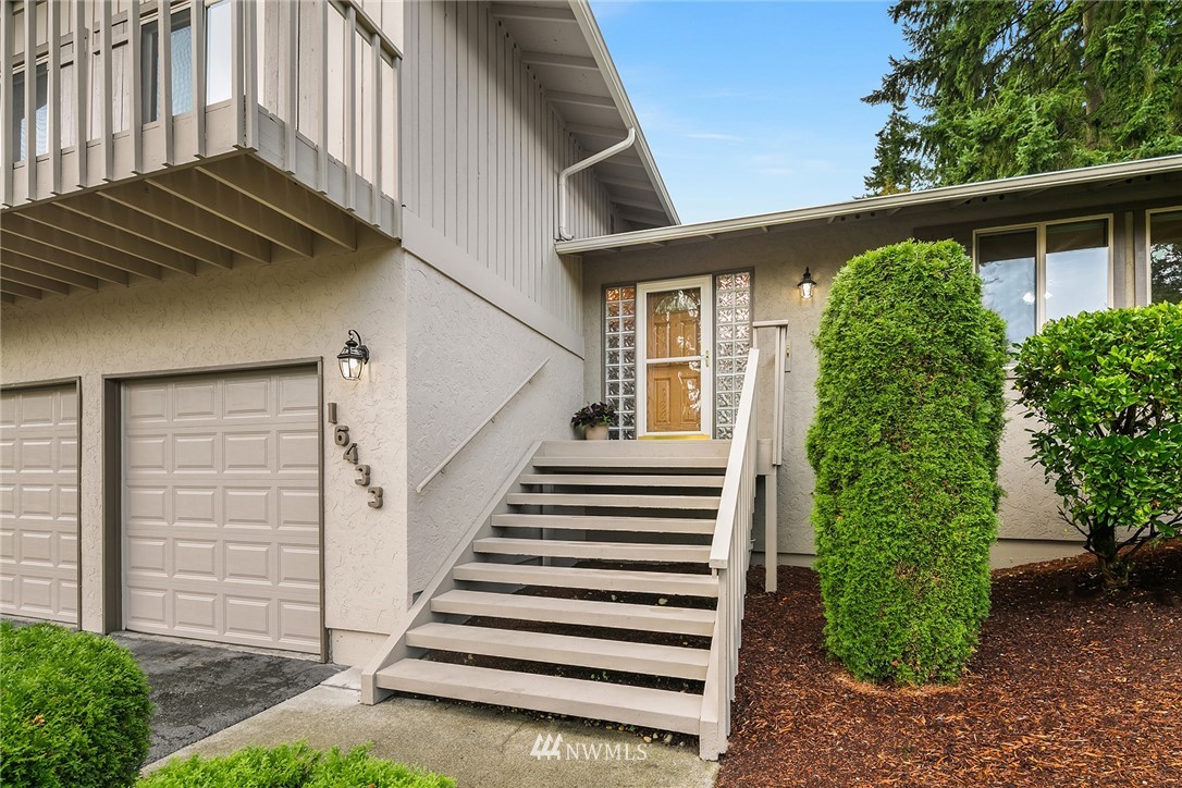 16433 Southeast 149th Street Renton, WA 98059 - Photo 2 of 22 a view of a backyard with plants