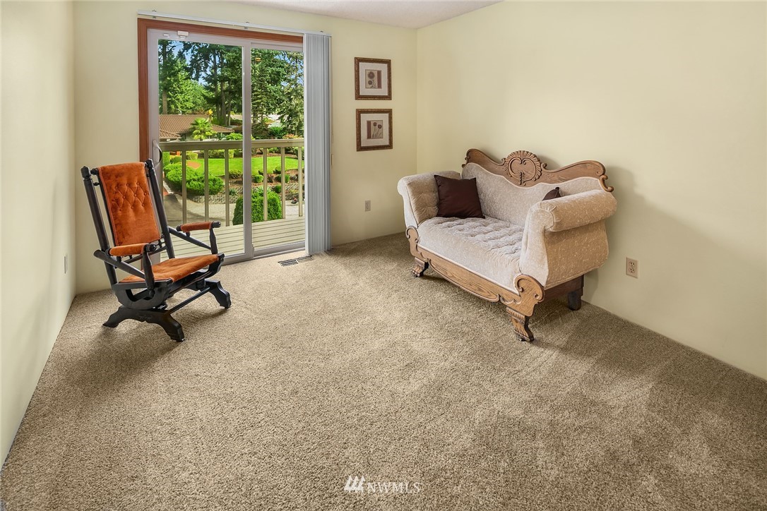 16433 Southeast 149th Street Renton, WA 98059 - Photo 14 of 22 a living room with furniture and a window
