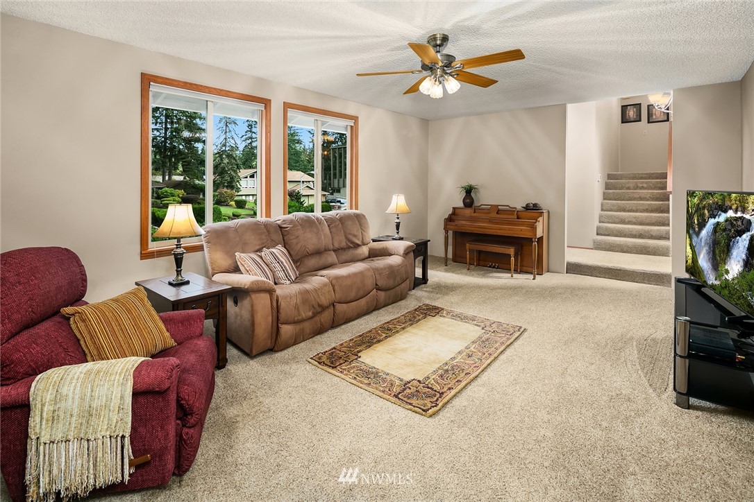16433 Southeast 149th Street Renton, WA 98059 - Photo 3 of 22 a living room with furniture and a flat screen tv