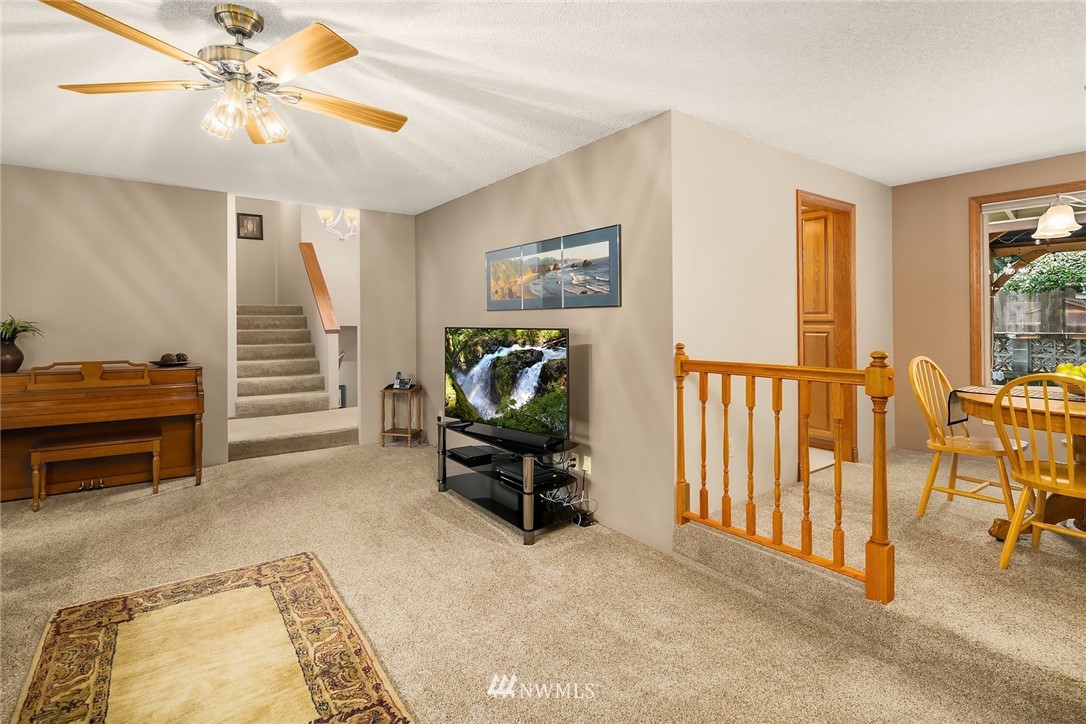 16433 Southeast 149th Street Renton, WA 98059 - Photo 5 of 22 a view of a livingroom with furniture and a workspace