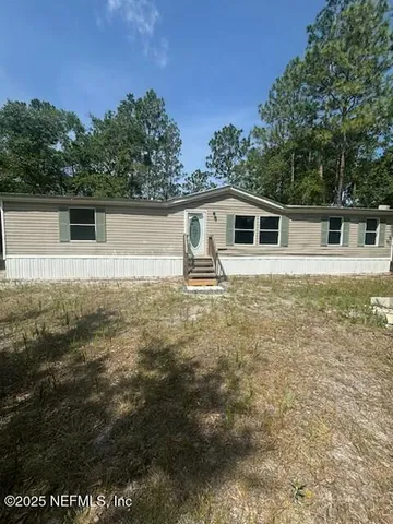 a backyard of a house with seating space