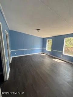 a view of an empty room with a window