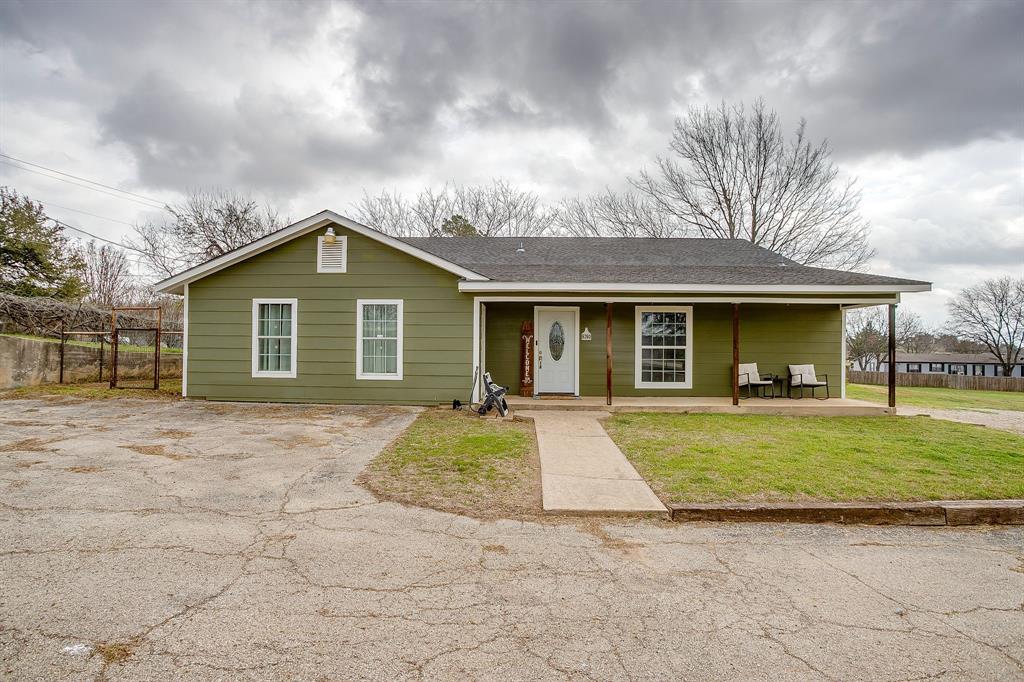 front view of a house with a yard