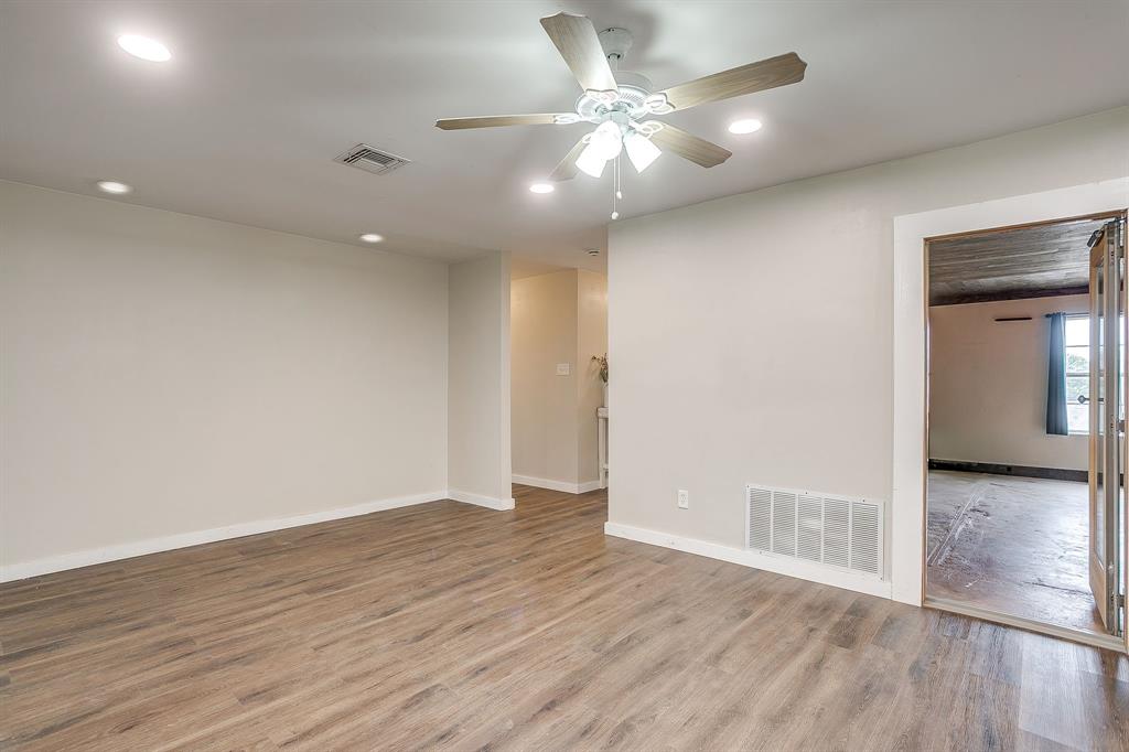 6260 Silver Creek Azle Road Azle, TX 76020 - Photo 12 of 40 wooden floor in an empty room with a window