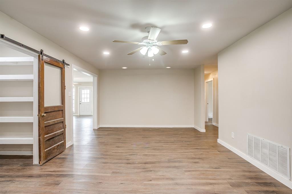 6260 Silver Creek Azle Road Azle, TX 76020 - Photo 13 of 40 an empty room with wooden floor closet and windows