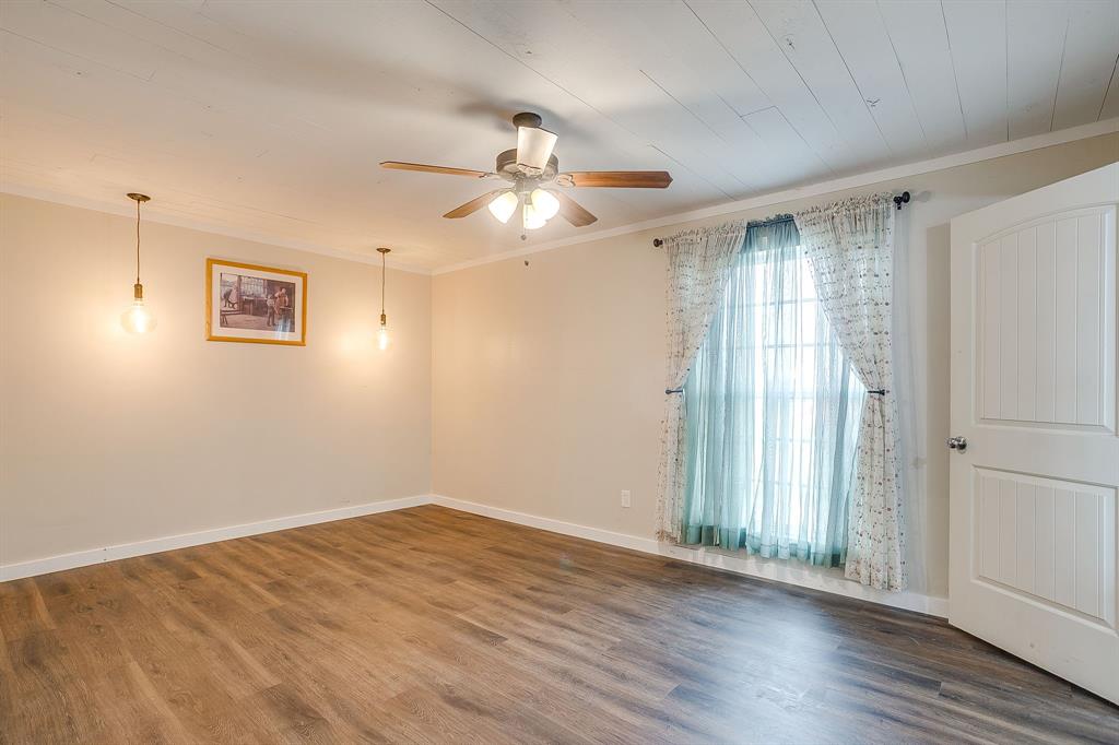 6260 Silver Creek Azle Road Azle, TX 76020 - Photo 16 of 40 wooden floor in an empty room with a window