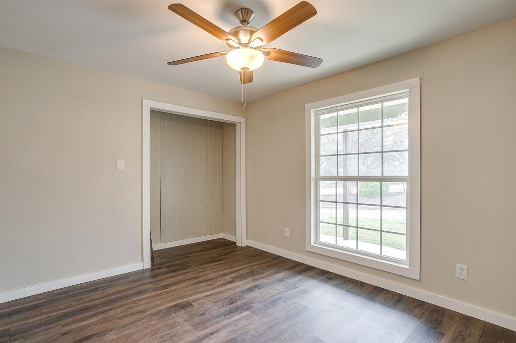 6260 Silver Creek Azle Road Azle, TX 76020 - Photo 21 of 40 an empty room with wooden floor and windows
