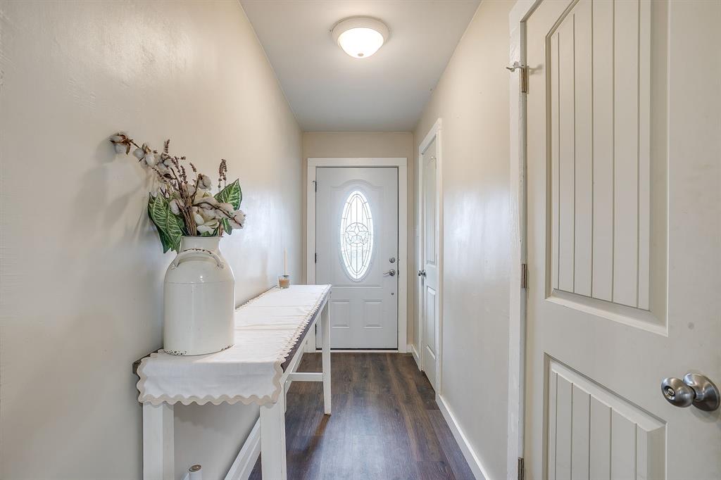 6260 Silver Creek Azle Road Azle, TX 76020 - Photo 3 of 40 a view of a hallway with entryway wooden floor and front door