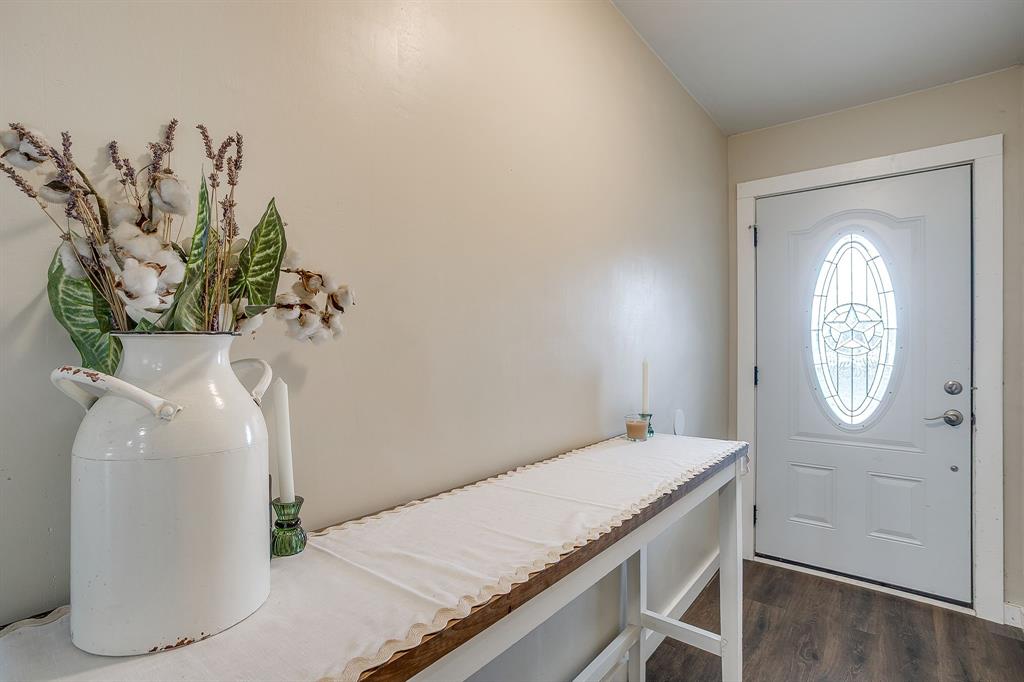 6260 Silver Creek Azle Road Azle, TX 76020 - Photo 34 of 40 a bathroom with a granite countertop sink a mirror and vanity
