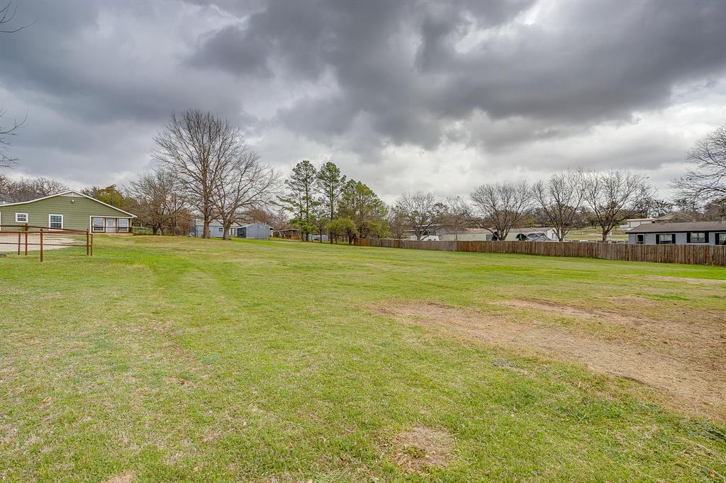 6260 Silver Creek Azle Road Azle, TX 76020 - Photo 38 of 40 a view of a lake with houses in the background