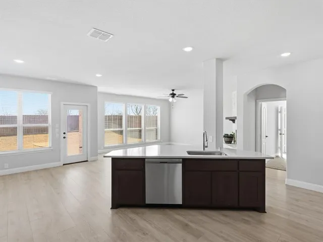 a room with a sink and a large window