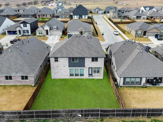 an aerial view of a house with swimming pool