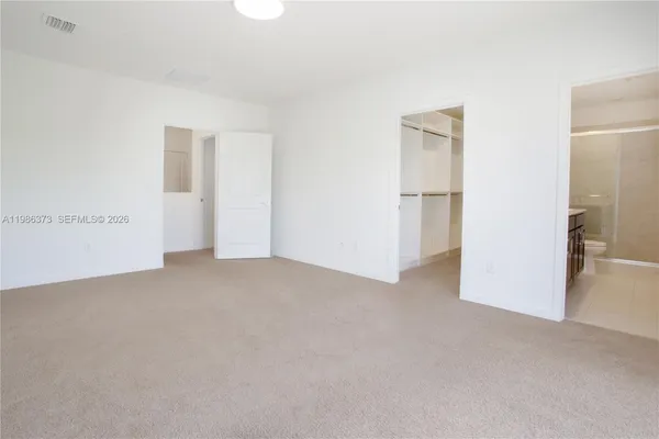 a bathroom with a double vanity sink toilet and shower
