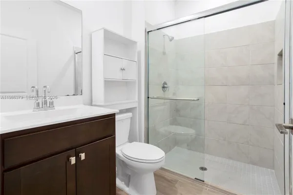 a view of hallway with wooden floor
