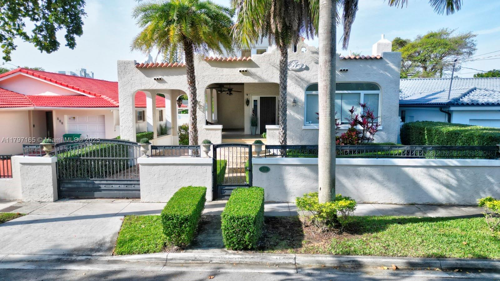a front view of a house with garden