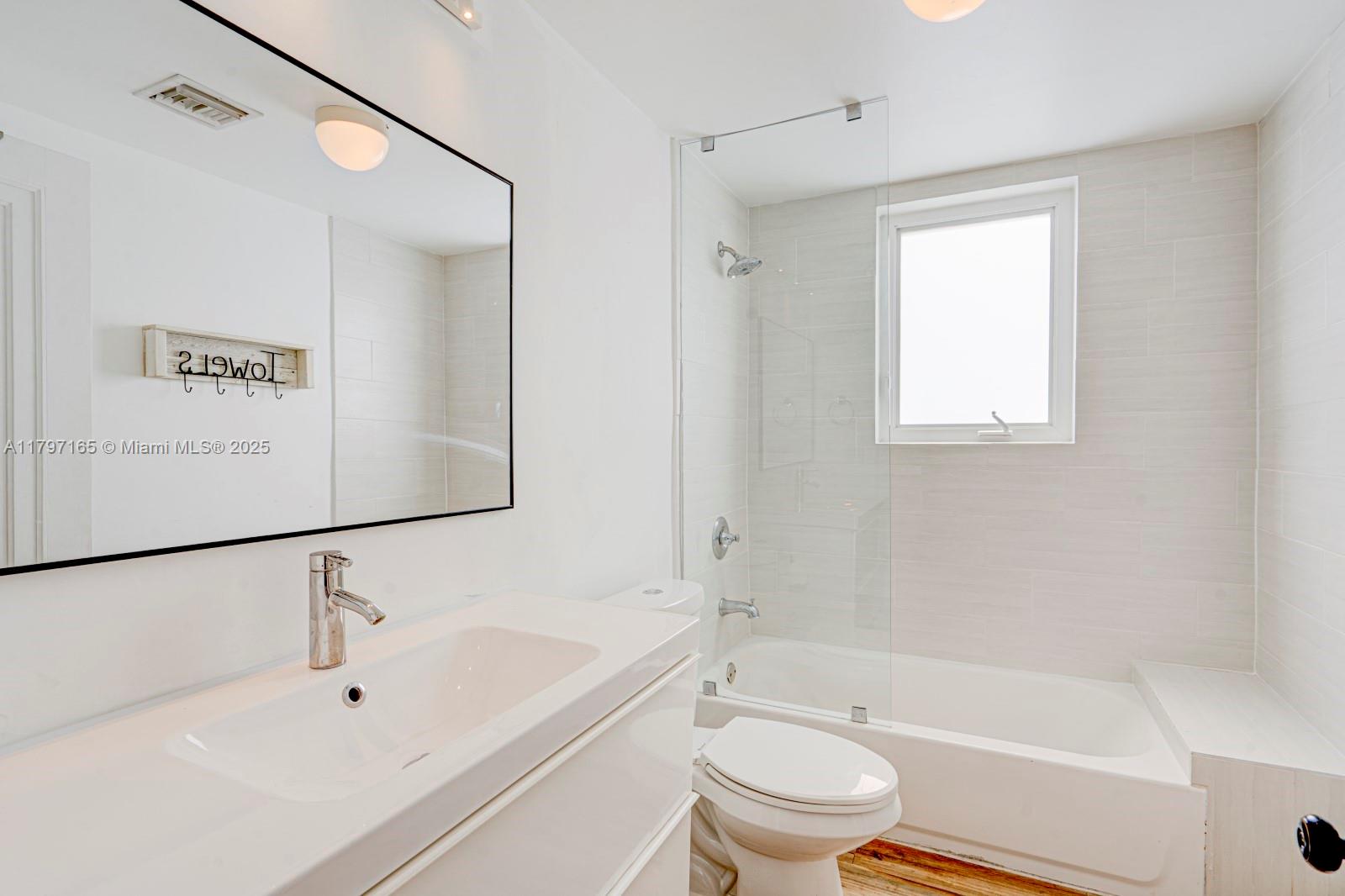 428 Southwest 23rd Road Miami, FL 33129 - Photo 18 of 36 a bathroom with a bathtub toilet and sink