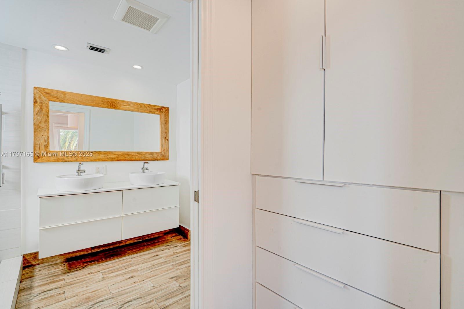 428 Southwest 23rd Road Miami, FL 33129 - Photo 19 of 36 a view of walk in closet with empty racks