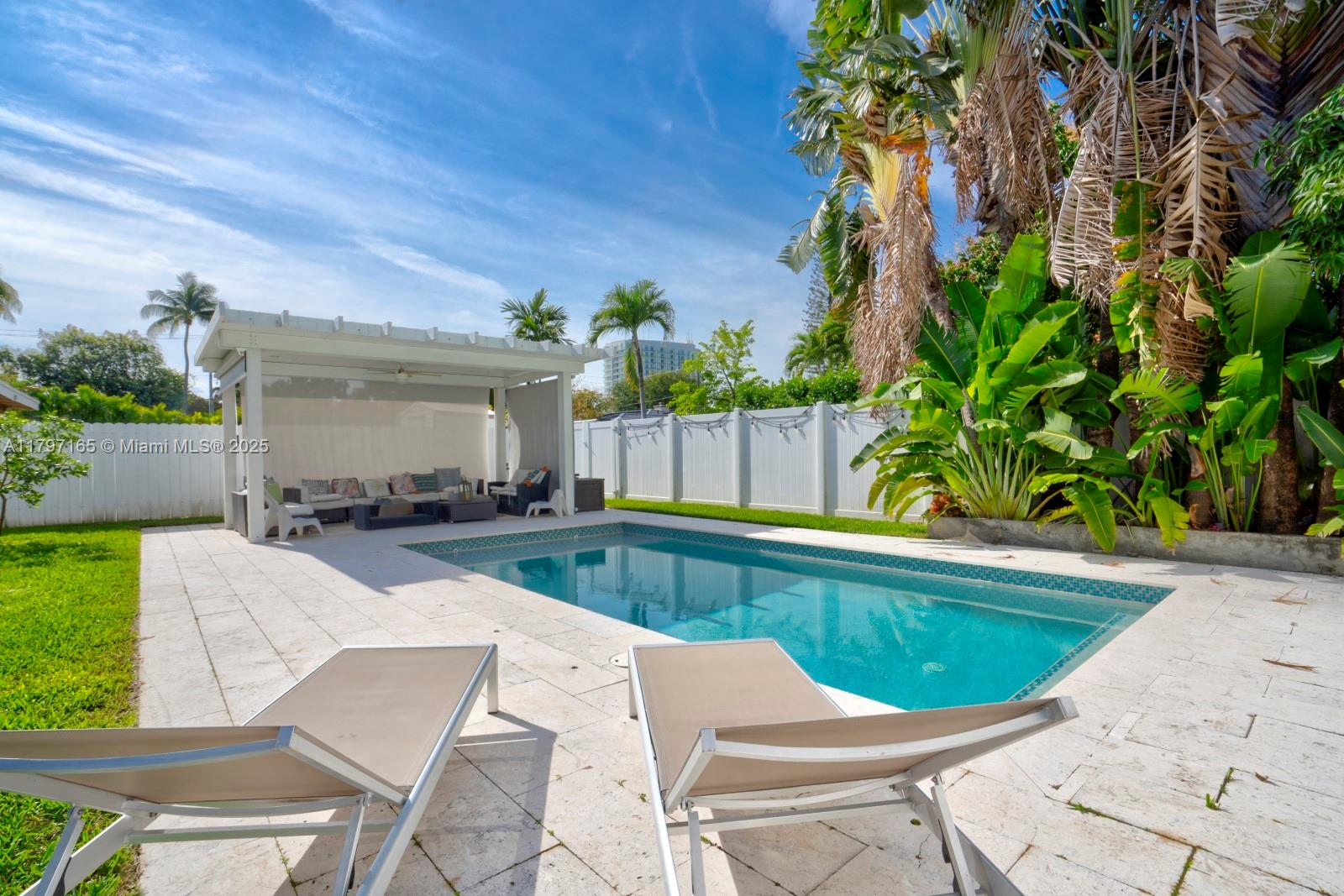 428 Southwest 23rd Road Miami, FL 33129 - Photo 27 of 36 a view of a swimming pool with a patio
