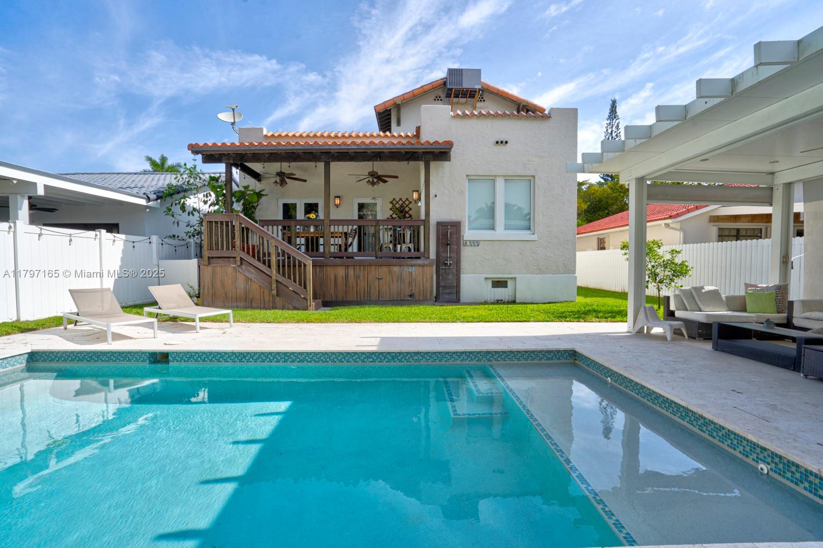 428 Southwest 23rd Road Miami, FL 33129 - Photo 29 of 36 a view of a kitchen with a large pool table and chairs