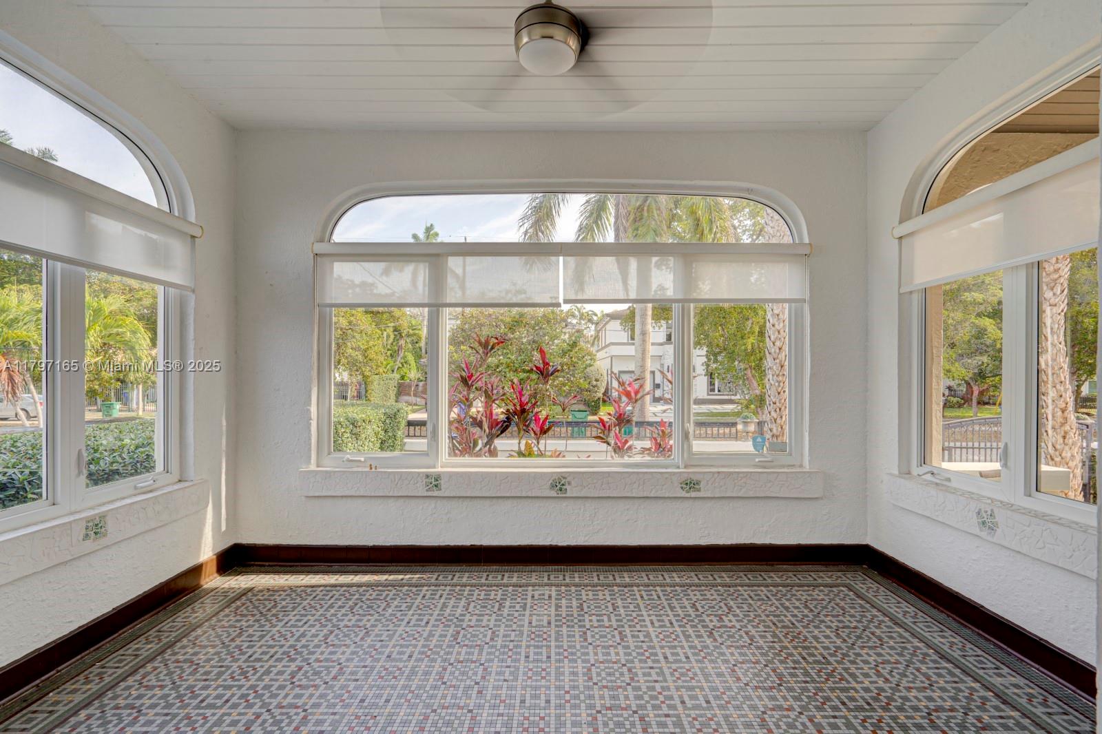 428 Southwest 23rd Road Miami, FL 33129 - Photo 5 of 36 an empty room with wooden floor and windows