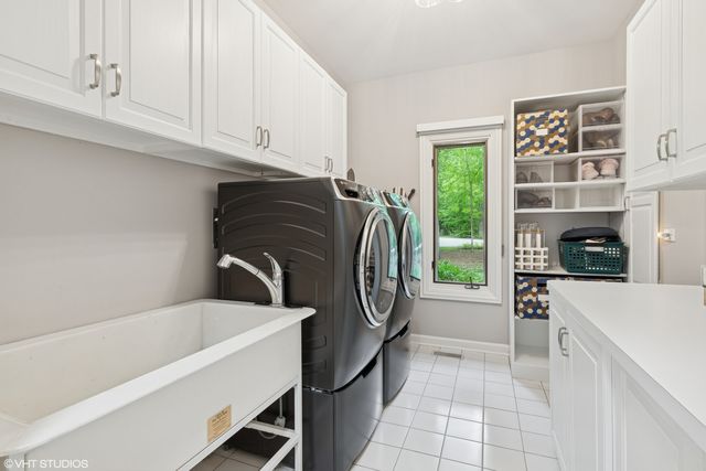 a kitchen with a refrigerator and a sink