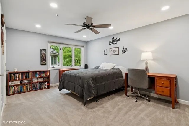 a bedroom with a bed dresser and a window