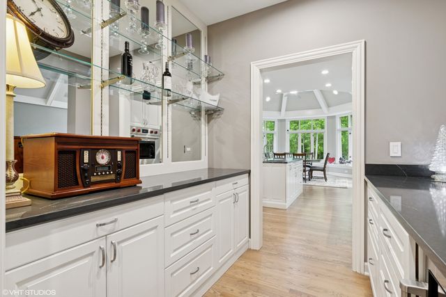 a kitchen with stainless steel appliances granite countertop a stove and cabinets