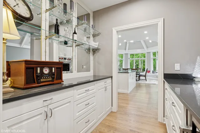 a kitchen with stainless steel appliances granite countertop a stove and cabinets