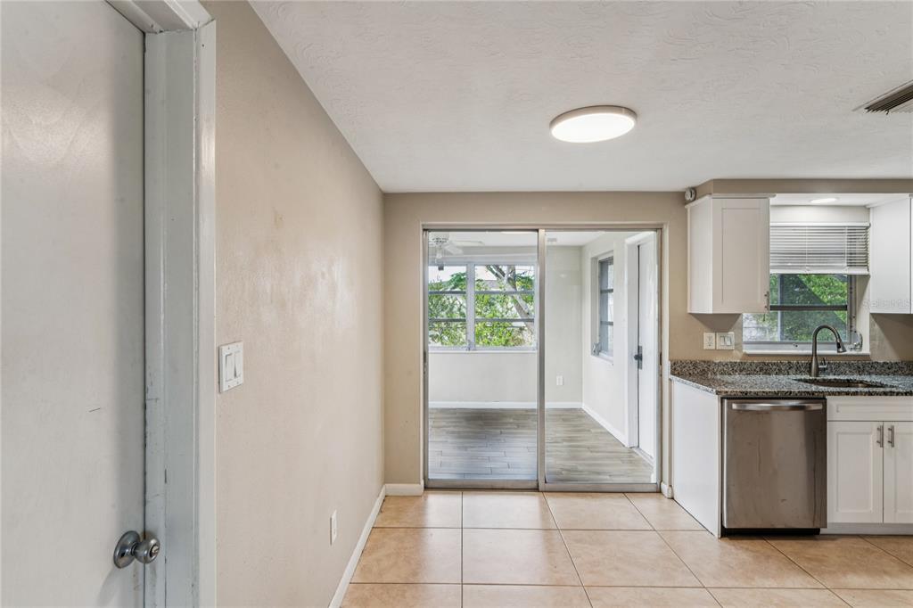 4837 Vision Avenue Holiday, FL 34690 - Photo 18 of 38 a view of a kitchen with white cabinets
