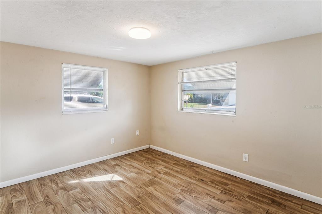 4837 Vision Avenue Holiday, FL 34690 - Photo 20 of 38 a view of empty room with wooden floor and fan