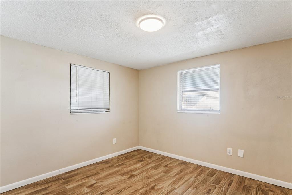 4837 Vision Avenue Holiday, FL 34690 - Photo 25 of 38 an empty room with a workspace