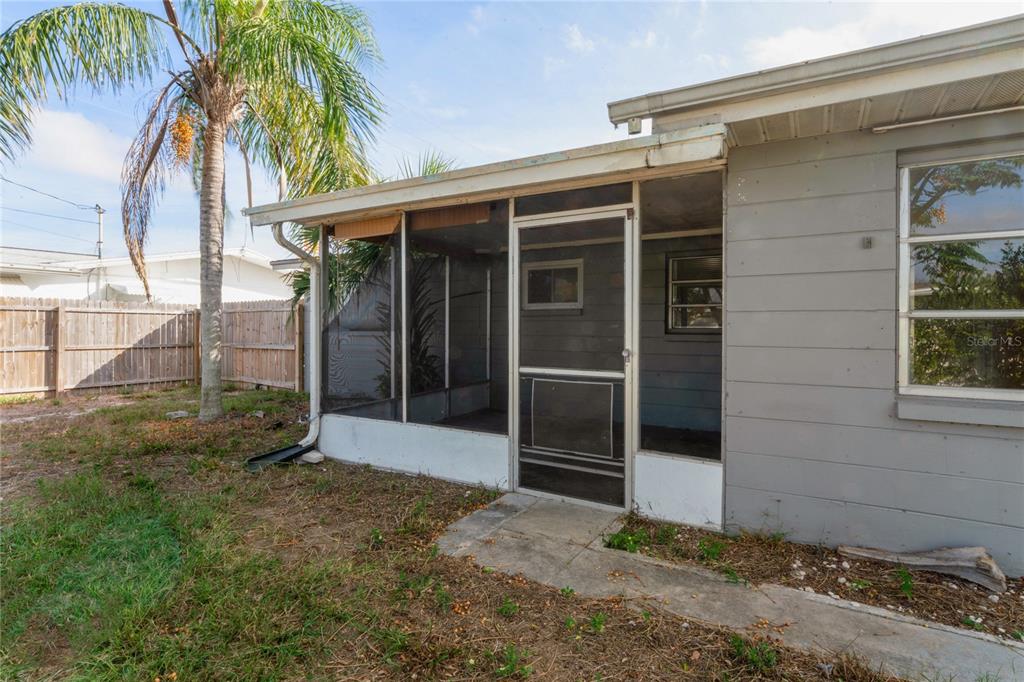 4837 Vision Avenue Holiday, FL 34690 - Photo 30 of 38 a view of front door and yard