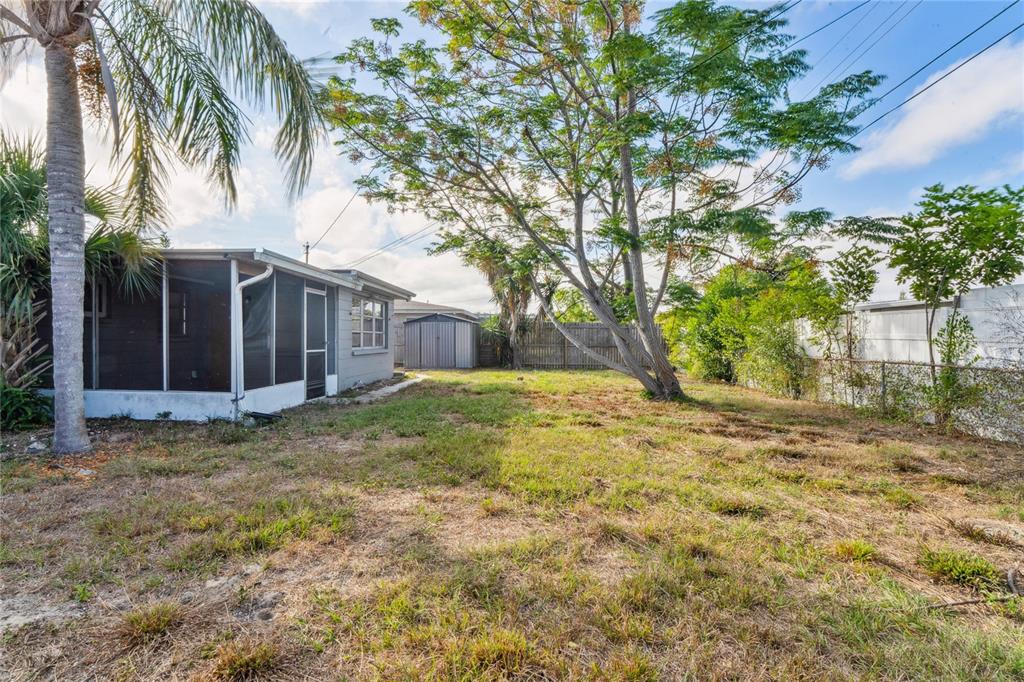 4837 Vision Avenue Holiday, FL 34690 - Photo 31 of 38 a view of a house with a yard