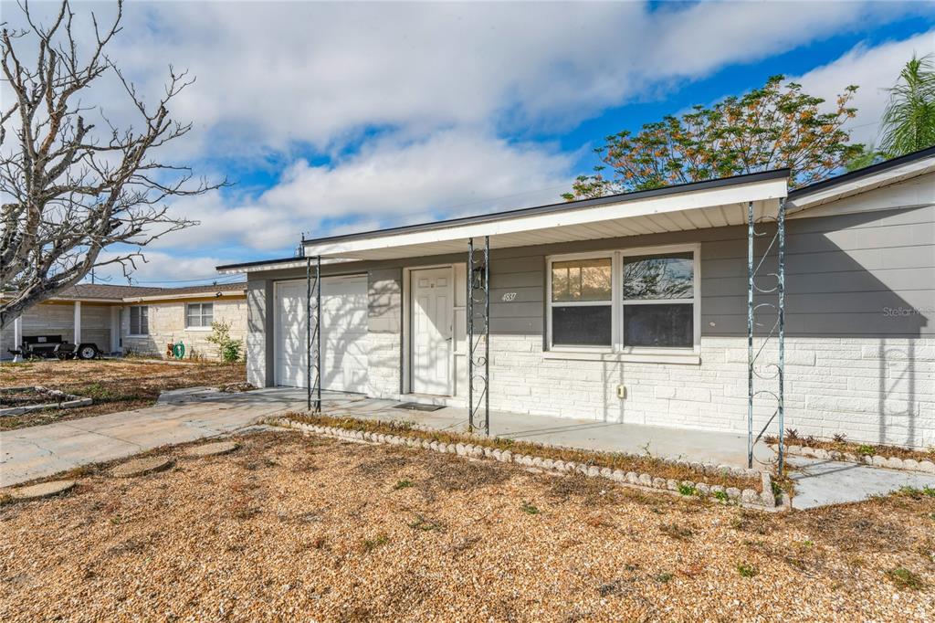 4837 Vision Avenue Holiday, FL 34690 - Photo 37 of 38 a big room with yard and balcony