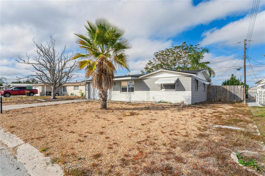 4837 Vision Avenue Holiday, FL 34690 - Photo 38 of 38 a house view with a outdoor space