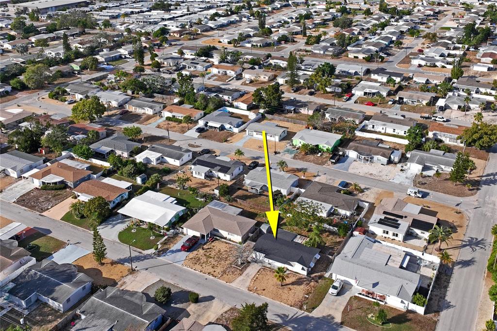 4837 Vision Avenue Holiday, FL 34690 - Photo 4 of 38 an aerial view of a city with lots of residential buildings
