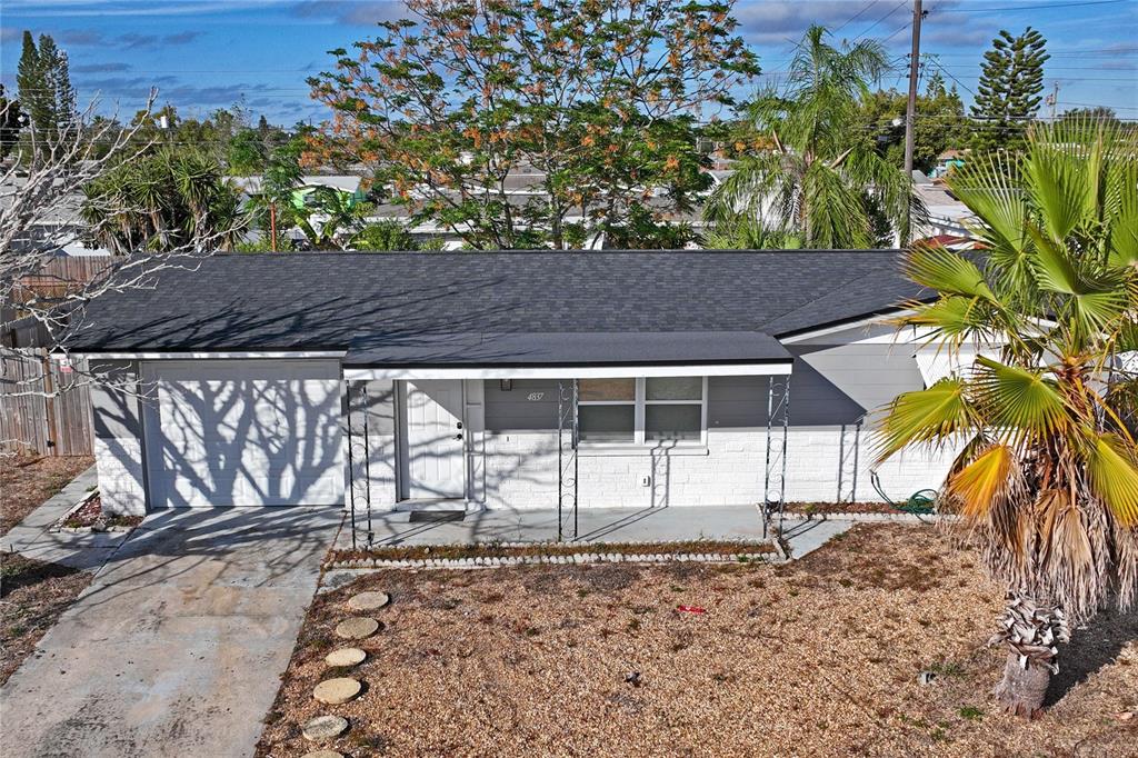 4837 Vision Avenue Holiday, FL 34690 - Photo 8 of 38 a backyard of a house with lots of green space