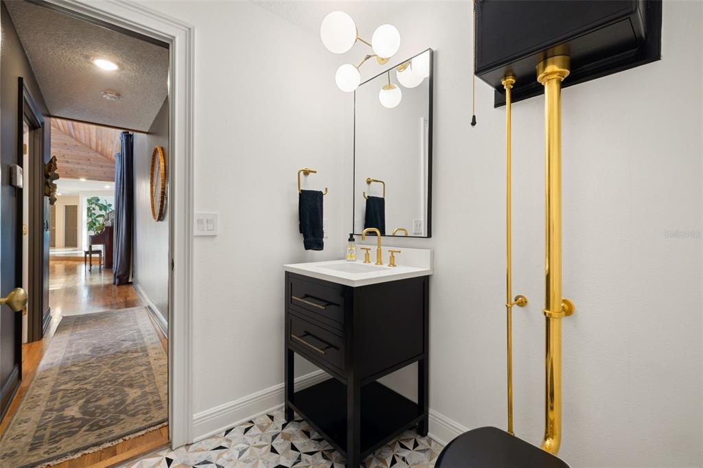 9116 Roberts Road Odessa, FL 33556 - Photo 18 of 94 a bathroom with a sink vanity and a mirror