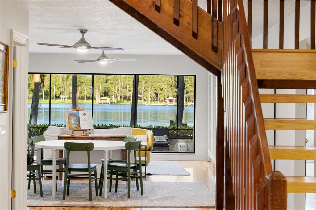 9116 Roberts Road Odessa, FL 33556 - Photo 31 of 94 a view of a dining room with furniture large windows and wooden floor