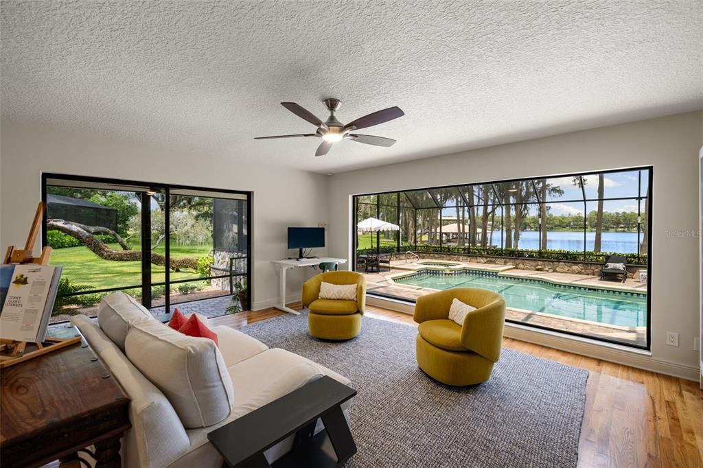 9116 Roberts Road Odessa, FL 33556 - Photo 37 of 94 a living room with furniture and a large window with outer view