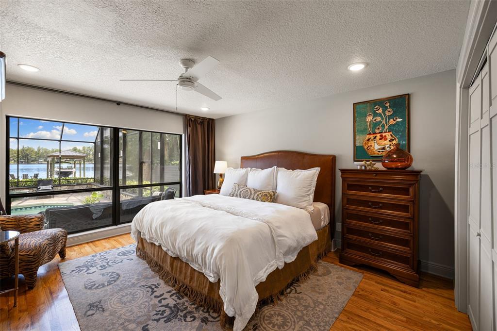 9116 Roberts Road Odessa, FL 33556 - Photo 42 of 94 a bedroom with a bed and large window with balcony view