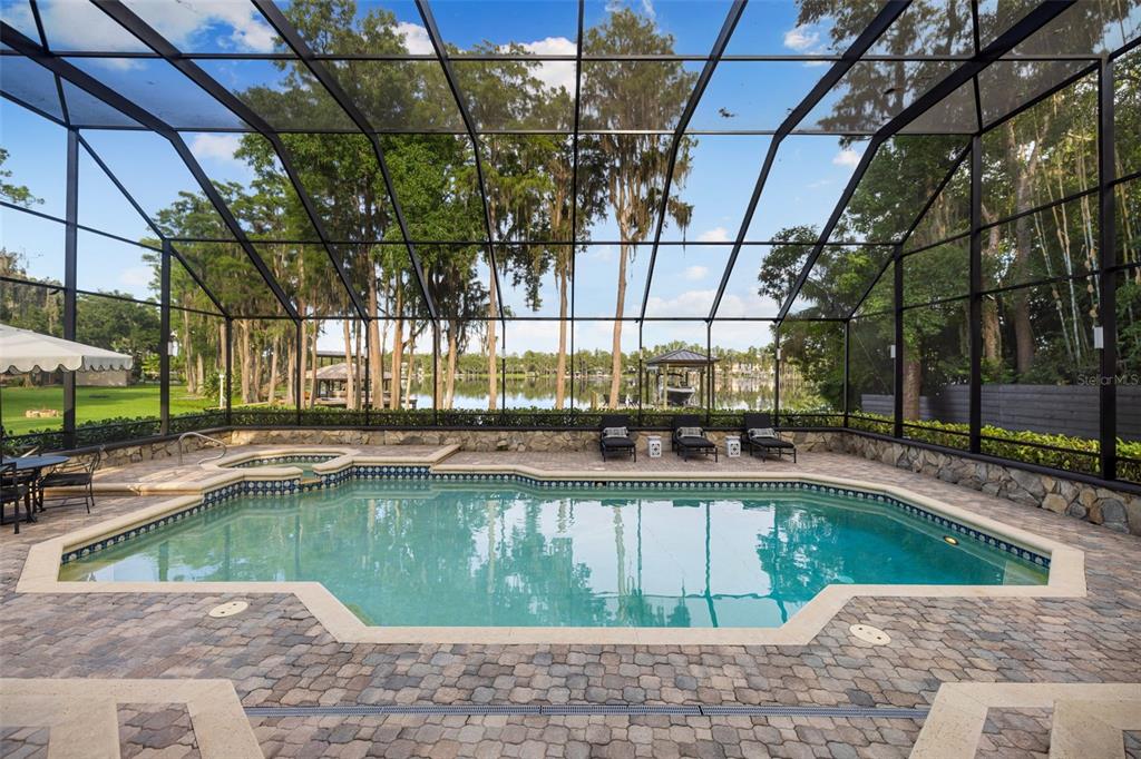 9116 Roberts Road Odessa, FL 33556 - Photo 65 of 94 a view of a swimming pool with a patio and a yard