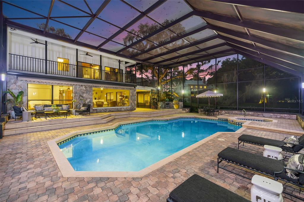 9116 Roberts Road Odessa, FL 33556 - Photo 70 of 94 a swimming pool with outdoor seating