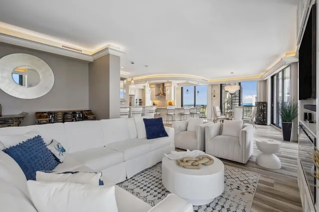 a kitchen with glass windows and table