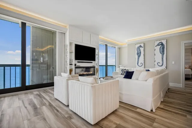 a view of a kitchen with a flat screen tv and outdoor space