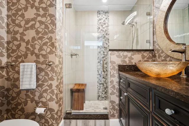 a spacious bedroom with a bed and a flat screen tv