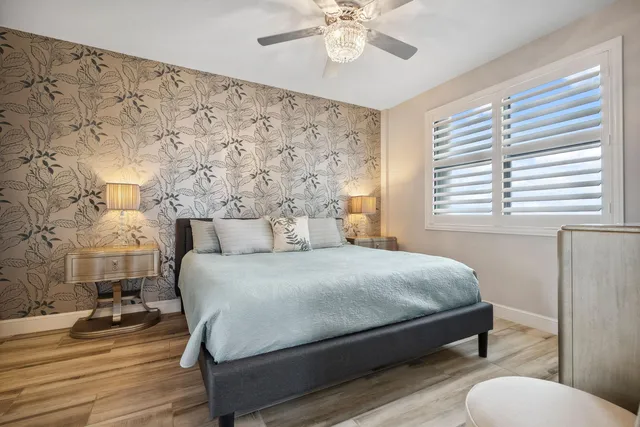 a bedroom with a bed and a mirror