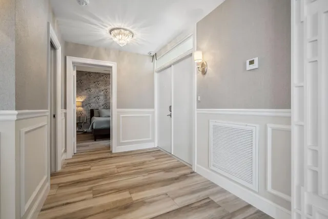 a kitchen with granite countertop a refrigerator and a sink